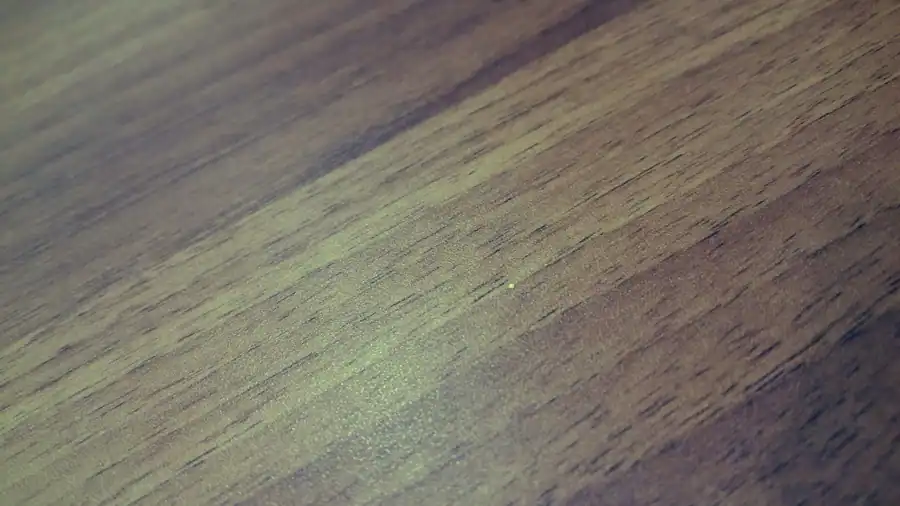 Detailed close-up of a smooth and textured wooden floor, showcasing natural grain patterns.